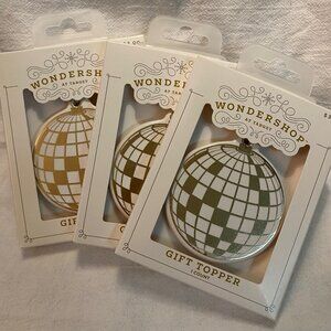 Wondershop gift toppers/ornaments -- disco ball or Sunsphere?